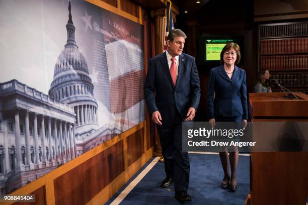 Sen. Joe Manchin and Sen. Susan Collins arrive for a press conference after the Senate passed a procedural vote for a continuing resolution to fund...