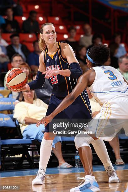 Katie Douglas of the Indiana Fever looks to pass over Dominique Canty of the Chicago Sky during the WNBA game on September 10, 2009 at the UIC...