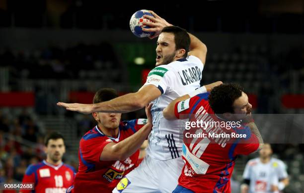 Bogdan Radivojevic of Serbia challenges Romain Lagarde of France during the Men's Handball European Championship main round match between Serbia and...