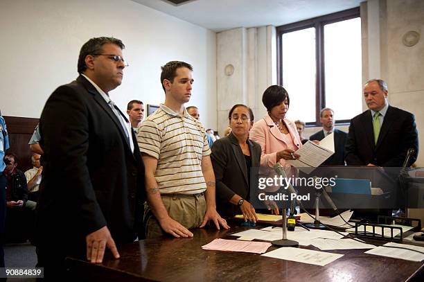 Raymond Clark III stands next to Assistant Public Defender Joseph E. Lopez and Senior Assistant Public Defender Beth Merkin as Bail Commissioner...