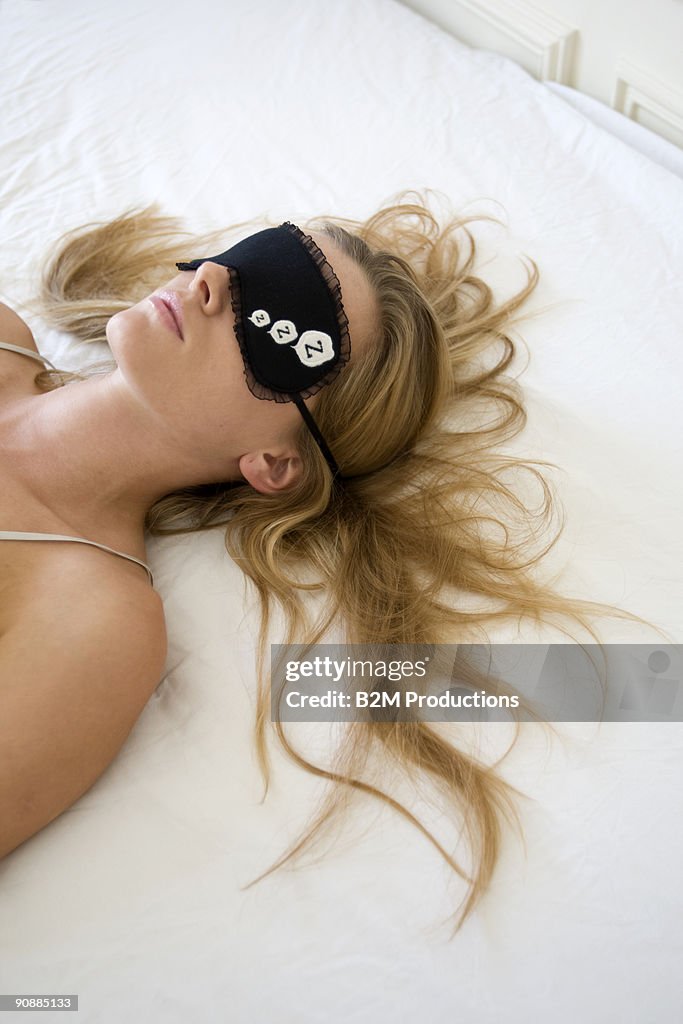 Woman sleeping with eye mask