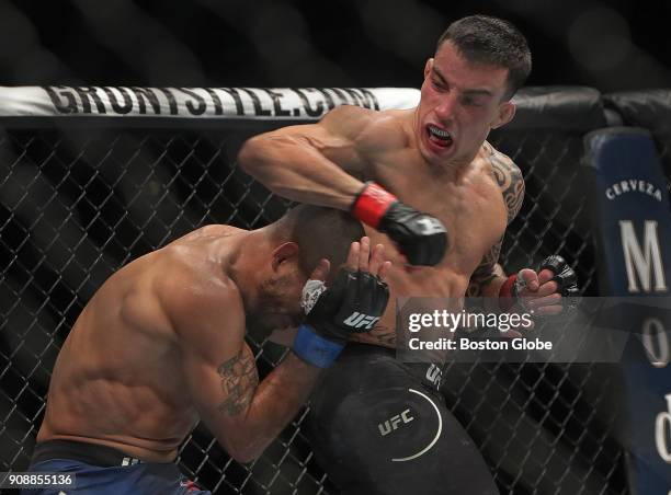 Bantamweight Rob Font ducks an elbow strike by Thomas Almeida en route to a knockout over Almeida during UFC 220 at TD Garden in Boston on Jan. 20,...