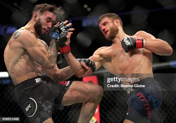 Calvin Kattar, right, throws a punch as he defeats Shane Burgos in a Featherweights match during UFC 220 at TD Garden in Boston on Jan. 20, 2018.