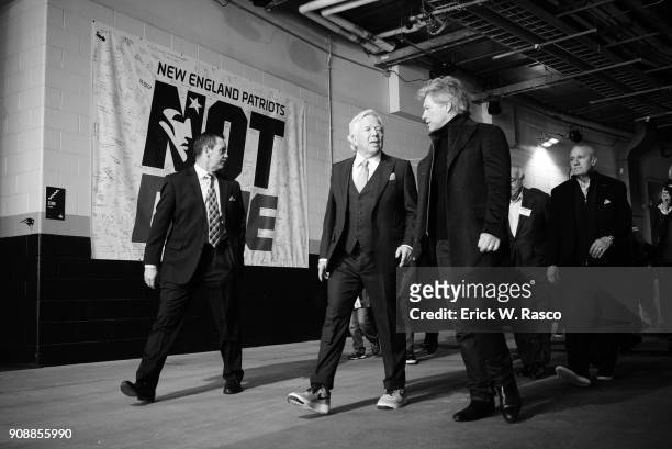 Playoffs: New England Patriots owner Robert Kraft walking through runway with singer Jon Bon Jovi on way to field before game vs Jacksonville Jaguars...