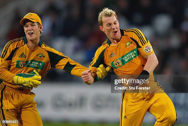 Australia wicketkeeper Tim Paine and bowler Brett Lee celebrate the wicket of Andrew Strauss during the 6th NatWest ODI between England and Australia...