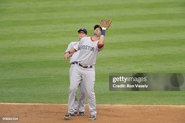 Mike Lowell catches a pop fly in front of Nick Green of the Boston Red Sox against the Chicago White Sox on September 5, 2009 at U.S. Cellular Field...