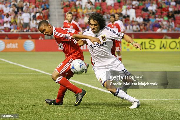 Fabian Espindola of Real Salt Lake goes after the ball against Mike Banner of Chicago Fire at Rio Tinto Stadium on September 12, 2009 in Sandy, Utah.