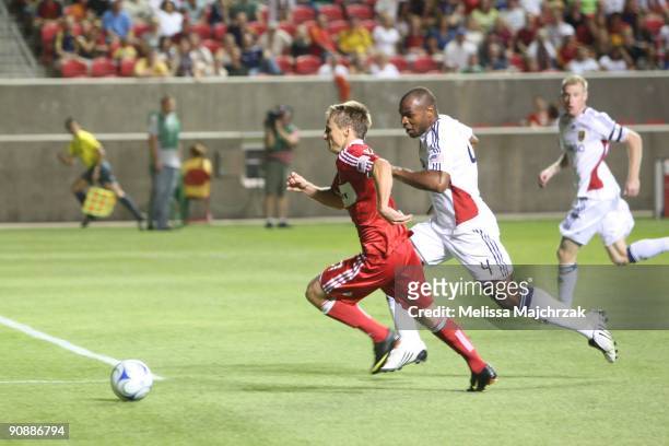 Brian McBride of Chicago Fire goes after the ball against Jamison Olave of Real Salt Lake at Rio Tinto Stadium on September 12, 2009 in Sandy, Utah.