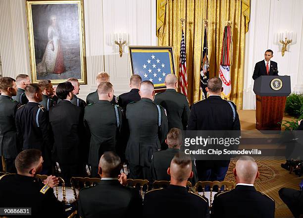 Members of the U.S. Army 10th Mountain Division unit that were with Sergeant First Class Jared C. Monti when he was killed stand and are recognized...