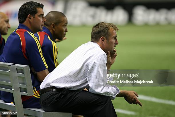 Head Coach Jason Kreis of Real Salt Lake sits on the bench during the game against the Chicago Fire at Rio Tinto Stadium on September 12, 2009 in...