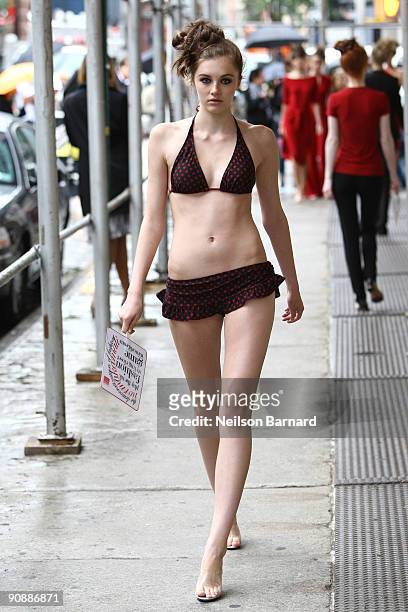 Model walks the runway at the Norma Kamali Spring 2010 Presentation on a sidewalk in SoHo on September 17, 2009 in New York City.