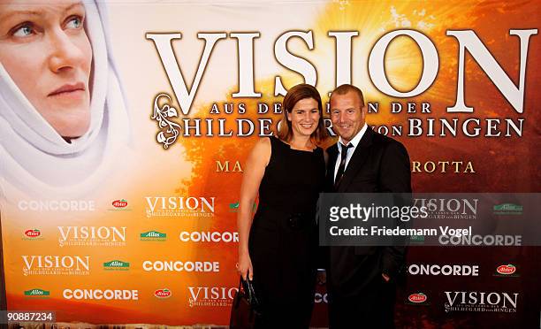 Marie-Jeanette Ferch and Heino Ferch pose on the red carpet before the premiere of the film 'Vision - From The Life Of Hildegard Von Bingen' by...