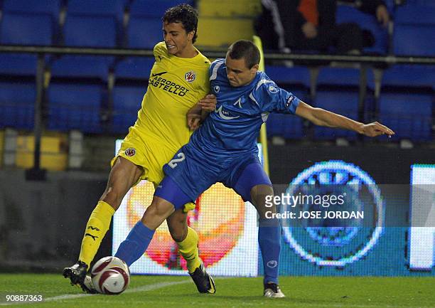 Villarreal's midfielder Cani figths for the ball with Levski´s Viktor Genev during their UEFA Europa league football match at Madrigal Stadium in...