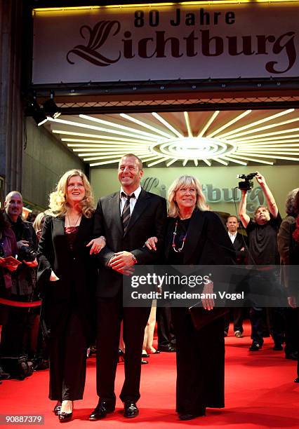 Margarethe von Trotta , Heino Ferch and Barbara Sukowa pose on the red carpet as they arrive for the premiere of the film 'Vision - From The Life Of...