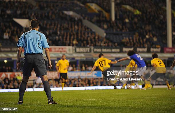 The Additional Assistant Referee watches the action from behind the goal line during the UEFA Europa League Group I match between Everton and AEK...