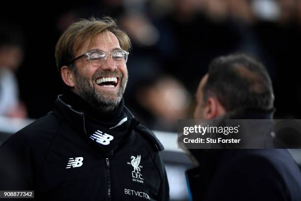 Jurgen Klopp, Manager of Liverpool speaks with Carlos Carvalhal, Manager of Swansea City prior to the Premier League match between Swansea City and...