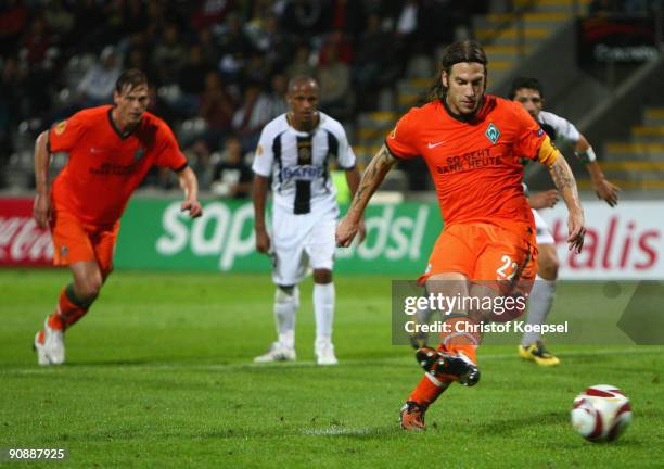 Torsten Frings of Bremen scores his team's first goal by penalty during the UEFA Europa League match between Nacional Funchal and SV Werder Bremen on...