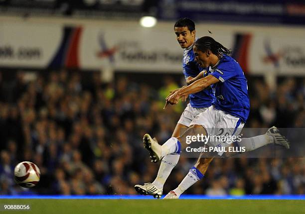 Everton's South African midfielder Steven Pienaar scores against AEK Athens during their UEFA Europa League football match at Goodison Park in...