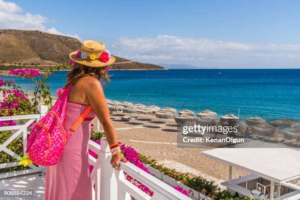 woman tourist is walking around the beach. palamutbuku, datca, mugla / turkey. - bodrum stock pictures, royalty-free photos & images