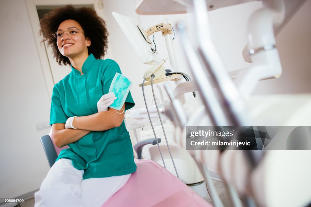 Young female dentist in her ordination