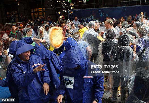 Jimmie Johnson takes part in the Largest Custard Pie fight during Guinness World Record Breaker Week on "LIVE! with Regis and Kelly" during NASCAR...