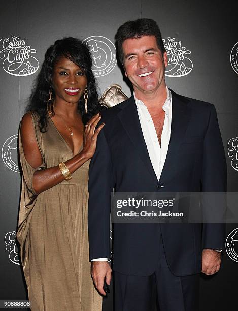 Simon Cowell and Sinitta arrive for the Collars and Cuffs Ball at the Royal Opera House on September 17, 2009 in London, England.