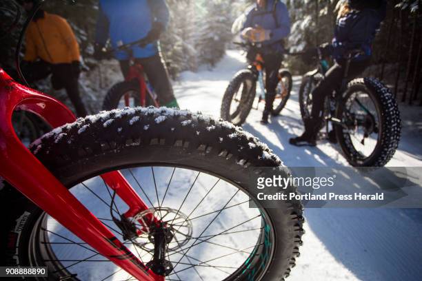 Group of fat bike enthusiasts head out on the Bethel Village Trails on Thursday, Jan. 18, 2018.