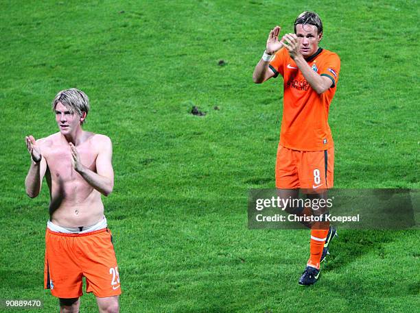 Peter Niemeyer and Clemens Fritz of Bremen celebrate the 3-2 victory after the UEFA Europa League match between Nacional Funchal and SV Werder Bremen...