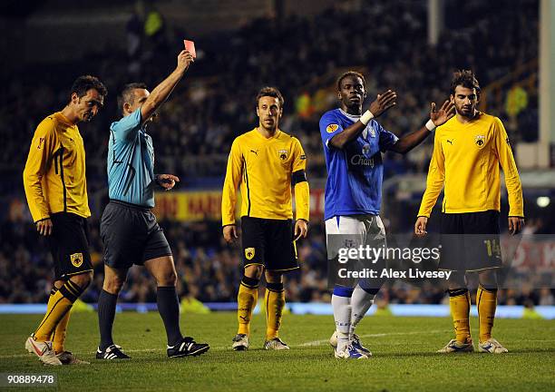 Louis Saha of Everton is sent off by referee Robert Malek during the UEFA Europa League Group I match between Everton and AEK Athens at Goodison Park...