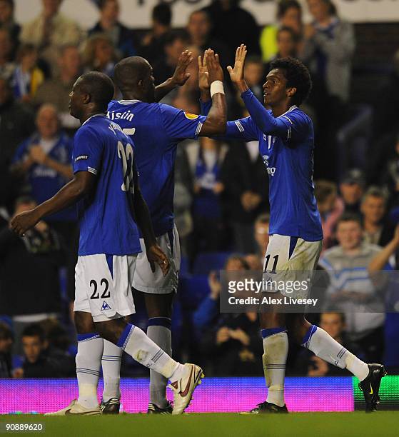 Jo of Everton celebrates with Sylvain Distin after scoring the fourth goal during the UEFA Europa League Group I match between Everton and AEK Athens...