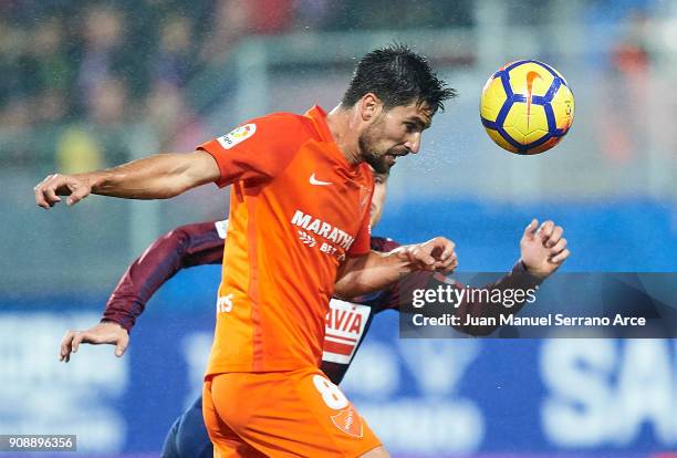 Daniel Garcia of SD Eibar duels for the ball with Adrian Gonzalez of Malaga CF during the La Liga match between SD Eibar and Malaga CF at Ipurua...