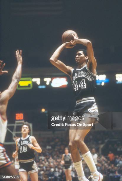 George Gervin of the San Antonio Spurs shoots against the New York Knicks during an NBA basketball game circa 1978 at Madison Square Garden in the...
