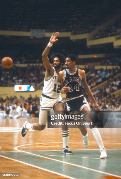 George Gervin of the San Antonio Spurs fights for position on Don Chaney of the Boston Celtics during an NBA basketball game circa 1979 at the Boston...