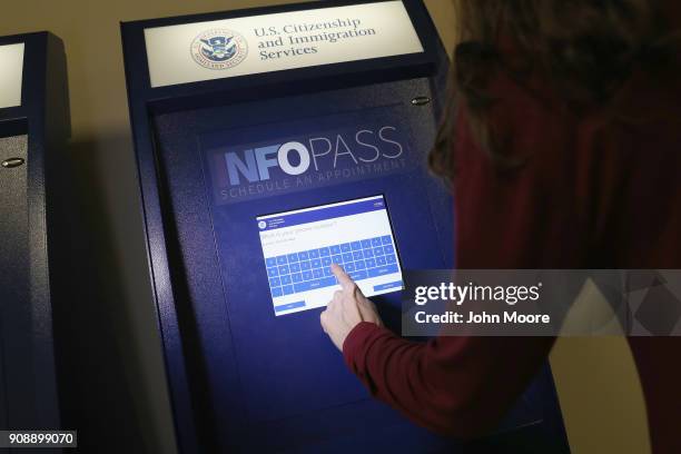 Woman sets up an appointment on an Infopass kiosk at U.S. Citizenship and Immigration Services , office on January 22, 2018 in Newark, New Jersey....