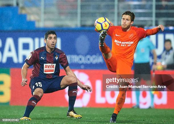 Jose Angel Valdes 'Cote' of SD Eibar duels for the ball with Sergio Gontan "Keko" of Malaga CF during the La Liga match between SD Eibar and Malaga...