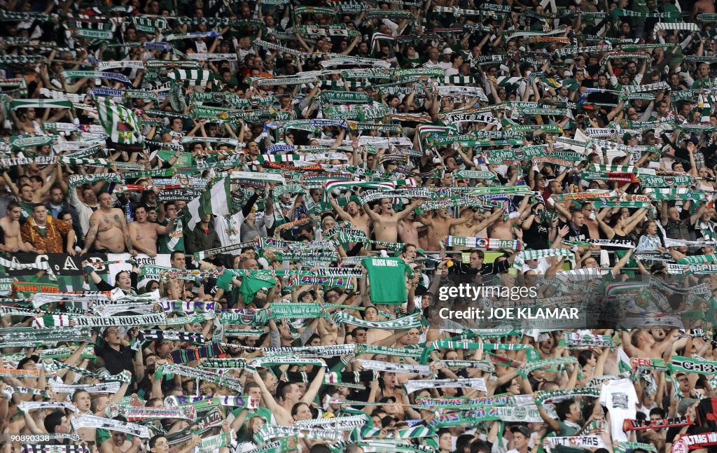 Fans of SK Rapid Vienna cheer for their