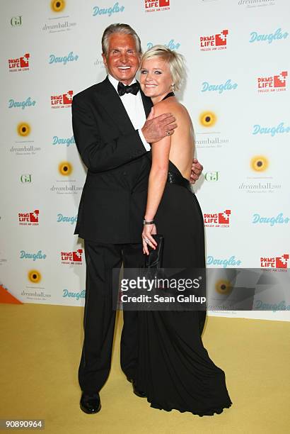 Actor George Hamilton and Barbara Sturm attend the dreamball 2009 charity gala at the Ritz-Carlton on September 17, 2009 in Berlin, Germany.