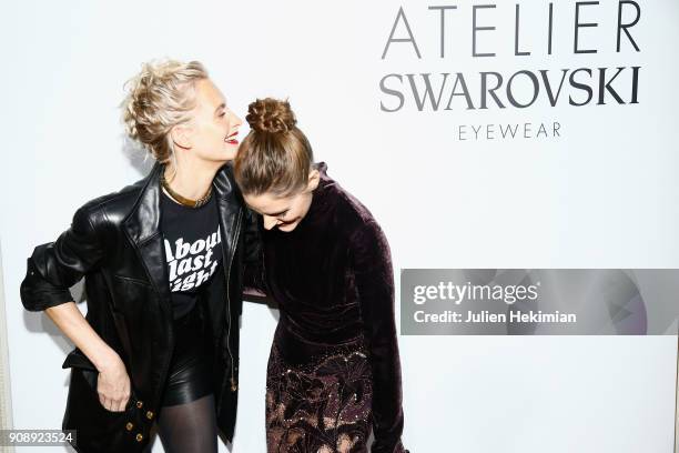 Poppy Delevingne and Olivia Palermo attend the Atelier Swarovski Eyewear Dinner as part of Paris Fashion Week at Hotel Crillon on January 22, 2018 in...