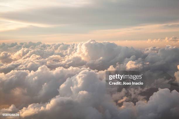 clouds seen from an airplane - cloud stock pictures, royalty-free photos & images