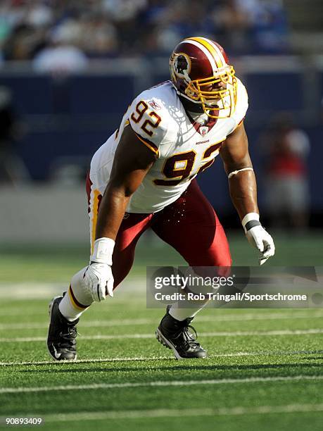 Albert Haynesworth of the Washington Redskins defends against the New York Giants during their game on September 13, 2009 at Giants Stadium in East...