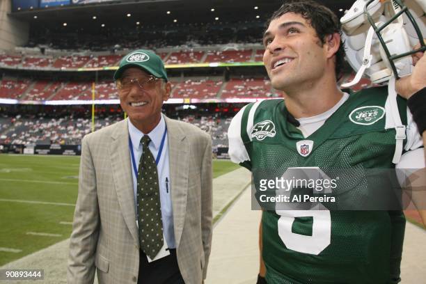 Quarterback Mark Sanchez of the New York Jets receives a pep talk from Hall of Fame Quarterback Joe Namath of the New York Jets before the game...