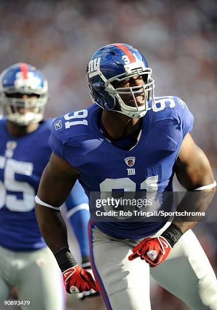 Justin Tuck of the New York Giants reacts against the Washington Redskins during their game on September 13, 2009 at Giants Stadium in East...