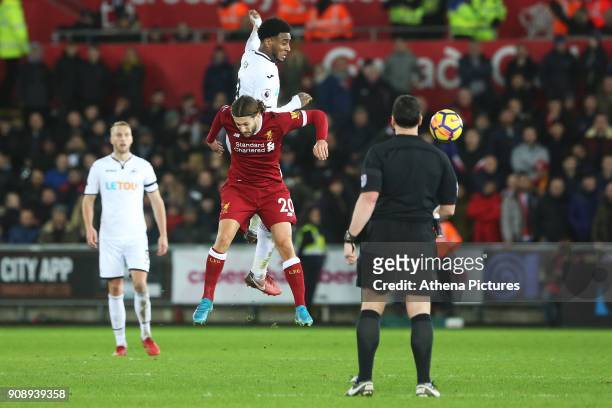 Leroy Fer of Swansea City contends with Adam Lallana of Liverpool during the Premier League match between Swansea City and Liverpool at the Liberty...