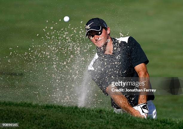 Sam Saunders hits out of the bunker on the 14th hole during the first round of the Albertson's Boise Open at Hillcrest Country Club on September 17,...
