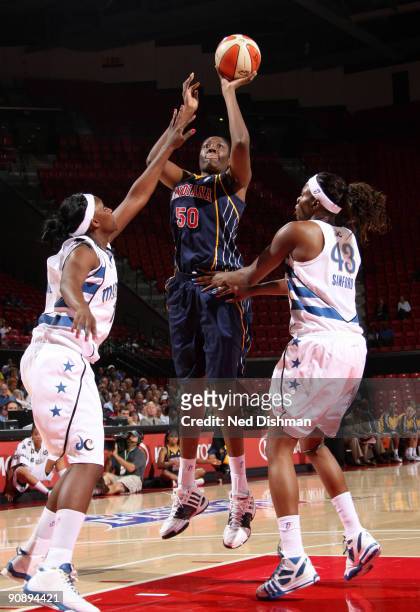 Jessica Davenport of the Indiana Fever shoots against Nakia Sanford of the Washington Mystics during Game One of the WNBA Eastern Conference...