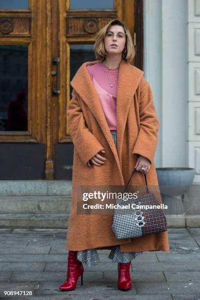 Sandra Ekenstam seen wearing Bitte Kai Rand coat with a bag from River Island during the second day of Stockholm Fashion Week outside the Grand Hotel...