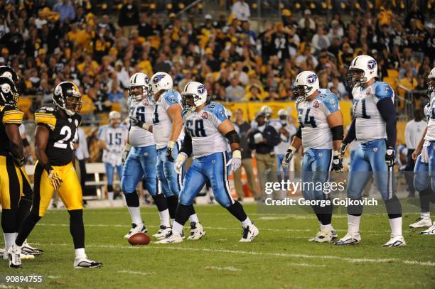 The offensive line of the Tennessee Titans, from left, David Stewart, Jake Scott, Kevin Mawae, Eugene Amano and Michael Roos, approach the line of...