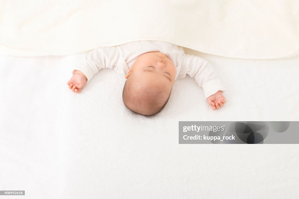 Baby sleeping in bed