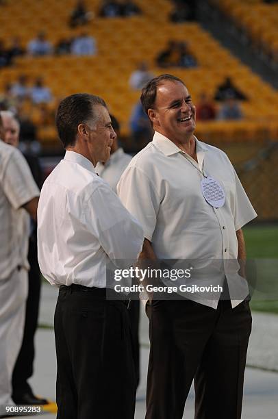 Team president Art Rooney II and director of football operations Kevin Colbert of the Pittsburgh Steelers look on from the sideline before a game...