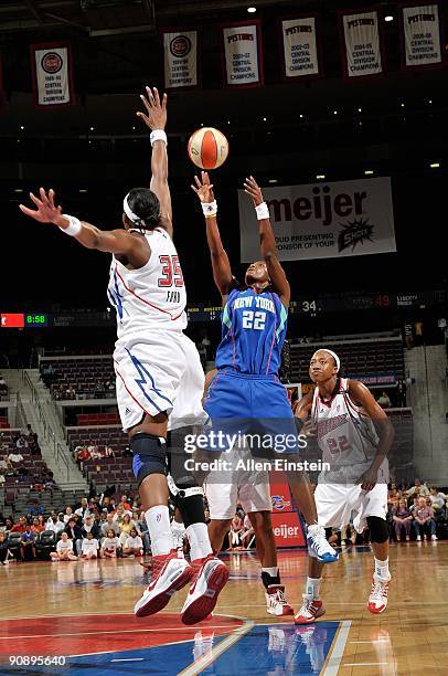 Ashley Battle of the New York Liberty shoots over Cheryl Ford of the Detroit Shock during the WNBA game on September 10, 2009 at The Palace of Auburn...